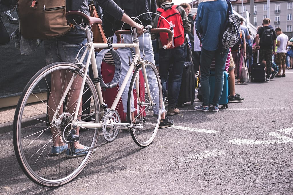 Image of people waiting in a long line.