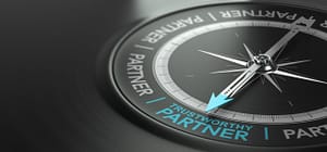 Picture of a compass pointed to the text “Trustworthy Partner.”