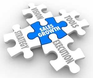 Sales growth puzzle pieces for personalizing the customer journey.