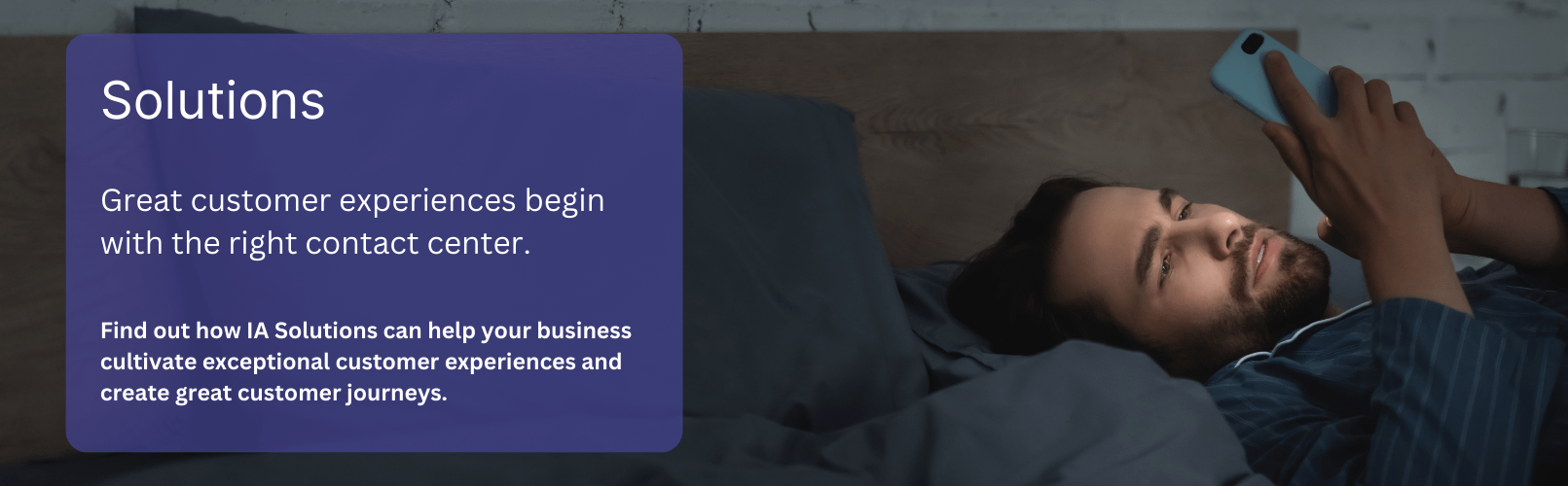 Man lying in bed using a smartphone to look for solutions to his problems.